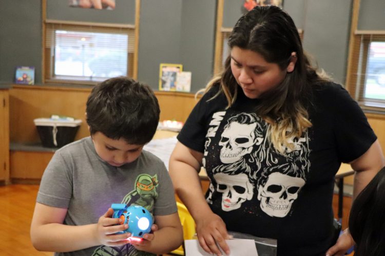 Parents engaged in Lab 101 activities.