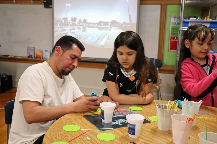 Parents engaged in Lab 101 activities.