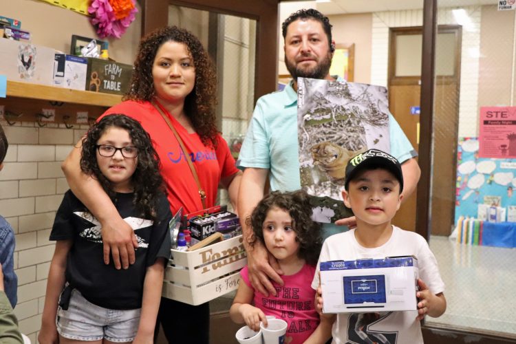 Beaupre family with STEM Family Night raffle prize.