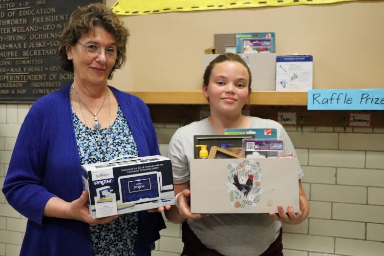 Beaupre family with STEM Family Night raffle prize.