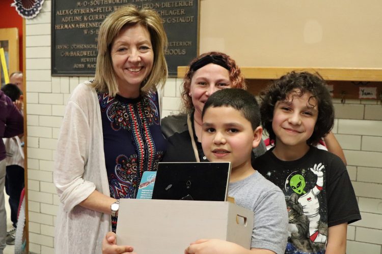 Beaupre family with STEM Family Night raffle prize.