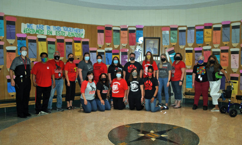 Hermes staff members dress in Hermes gear on School Spirit Day.