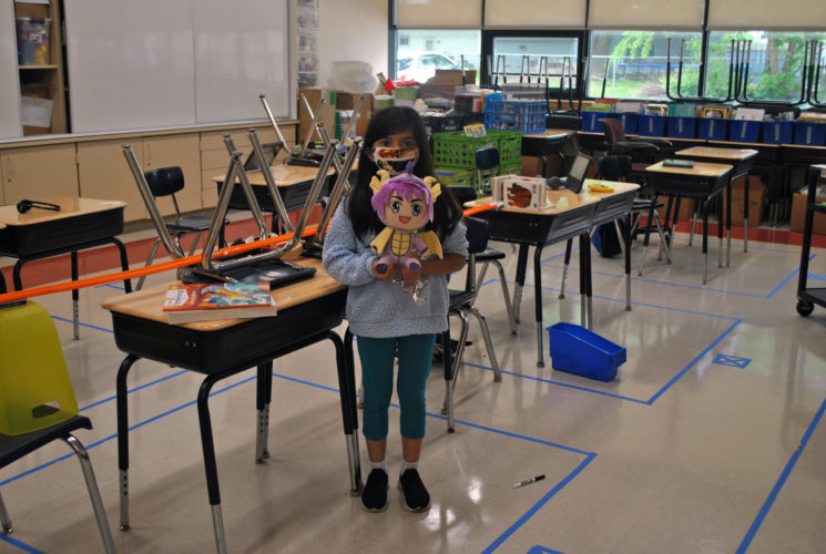 A student poses with her fluffy friend that accompanied her on Stuffed Animal Day.