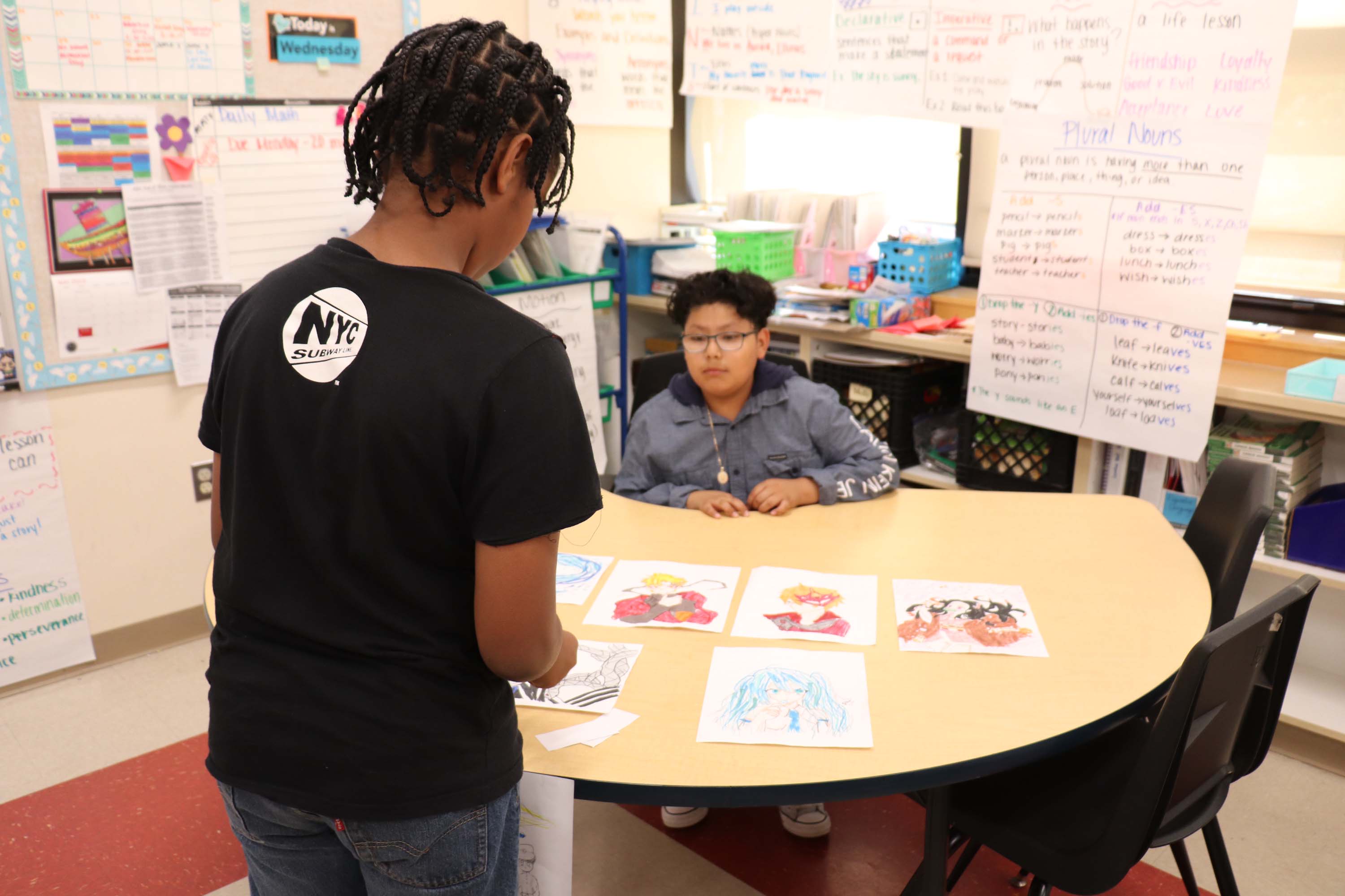 A student purchases handmade art from a shop.